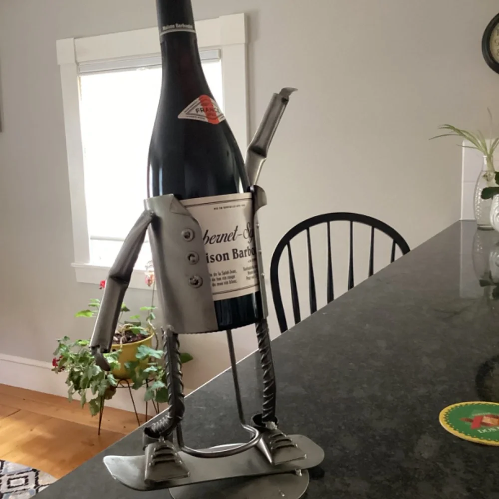 Wine bottle holder H & K steel on person on Skateboard?